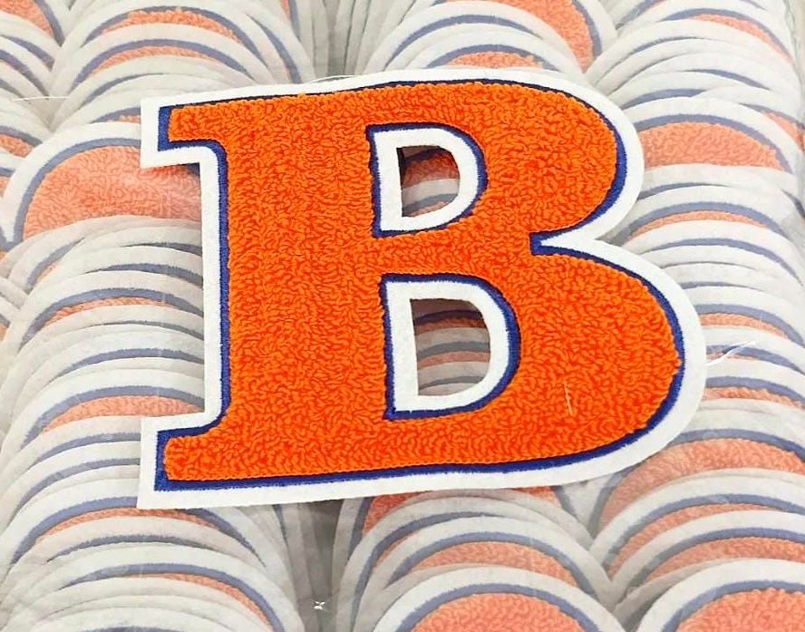 Embroidered letter patch detail
